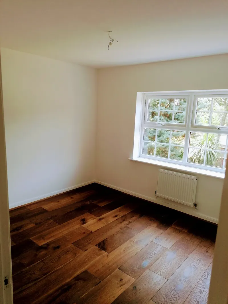 Finished room with oak floor and new window