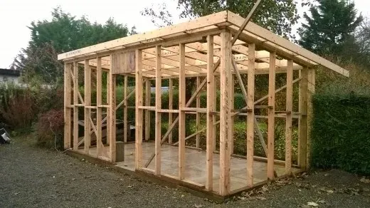 Timber frame of a garden room under construction