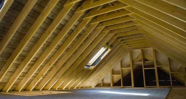 Loft roof timbers with roof window fitted